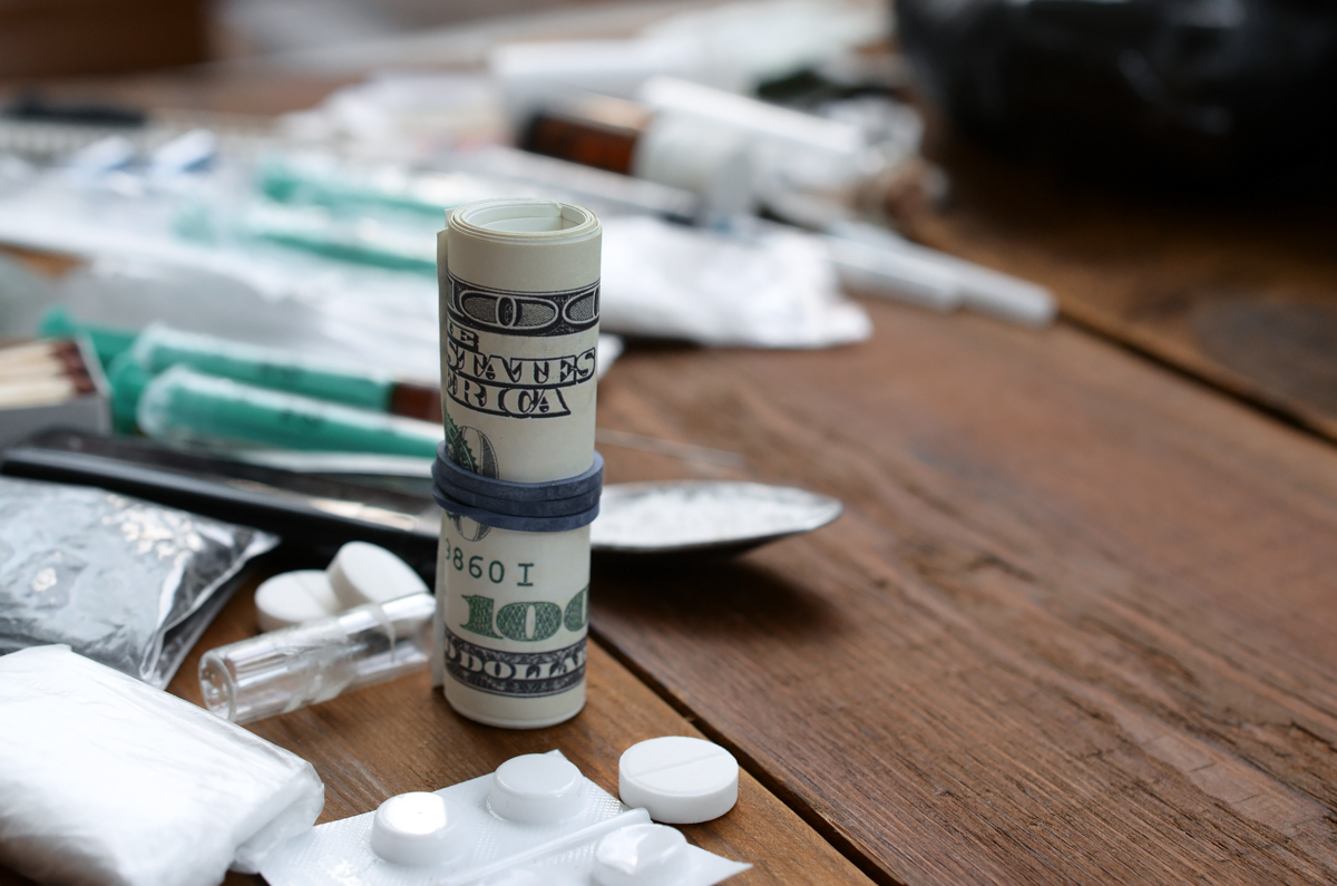 drugs like heroin and crack and money are pictured on a table in Fort Lauderdale to represent a drug crime in South Florida