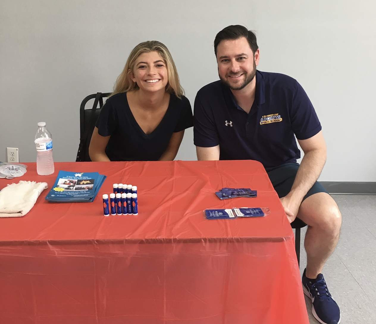 Criminal lawyer adam rossen with marketing assistant Olivia at a community event in coconut creek, florida