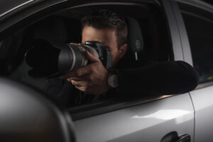 Man in car with camera
